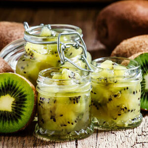 Homemade kiwi jam, vintage wooden background, selective focus