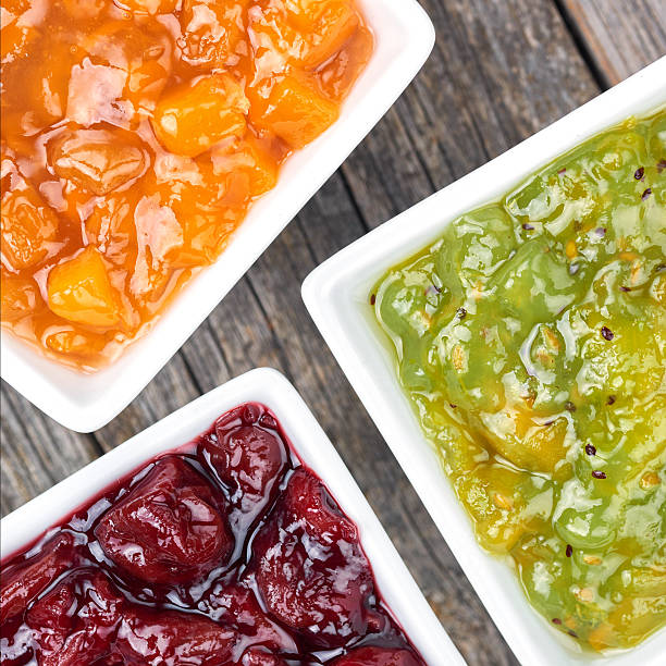 Set of fruit jams in white bowls
